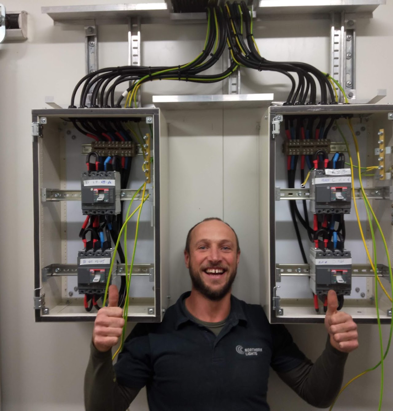Hannes Schulze in front of a commissioned switchboard install