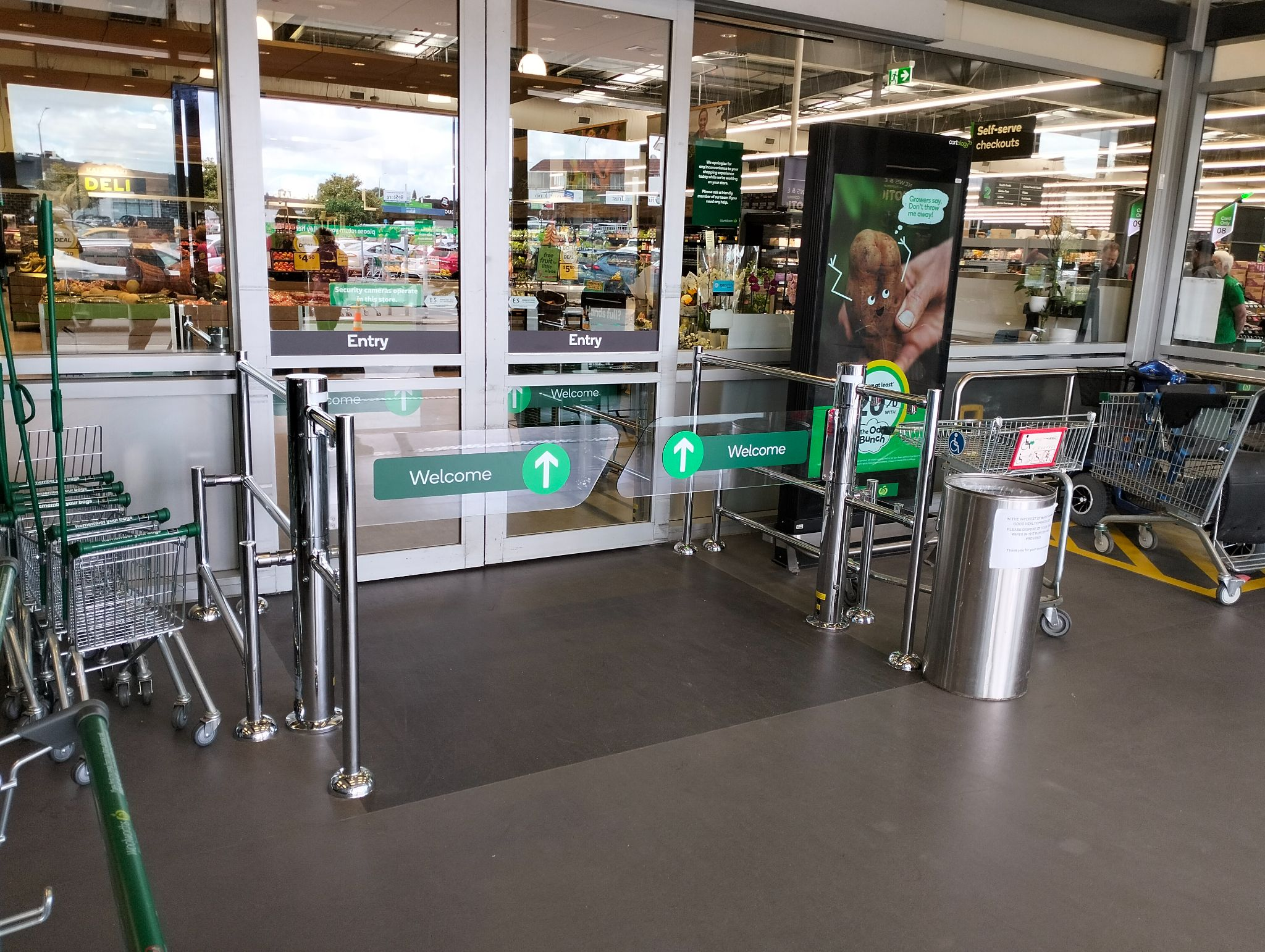 Supermarket access gates and entry doors install